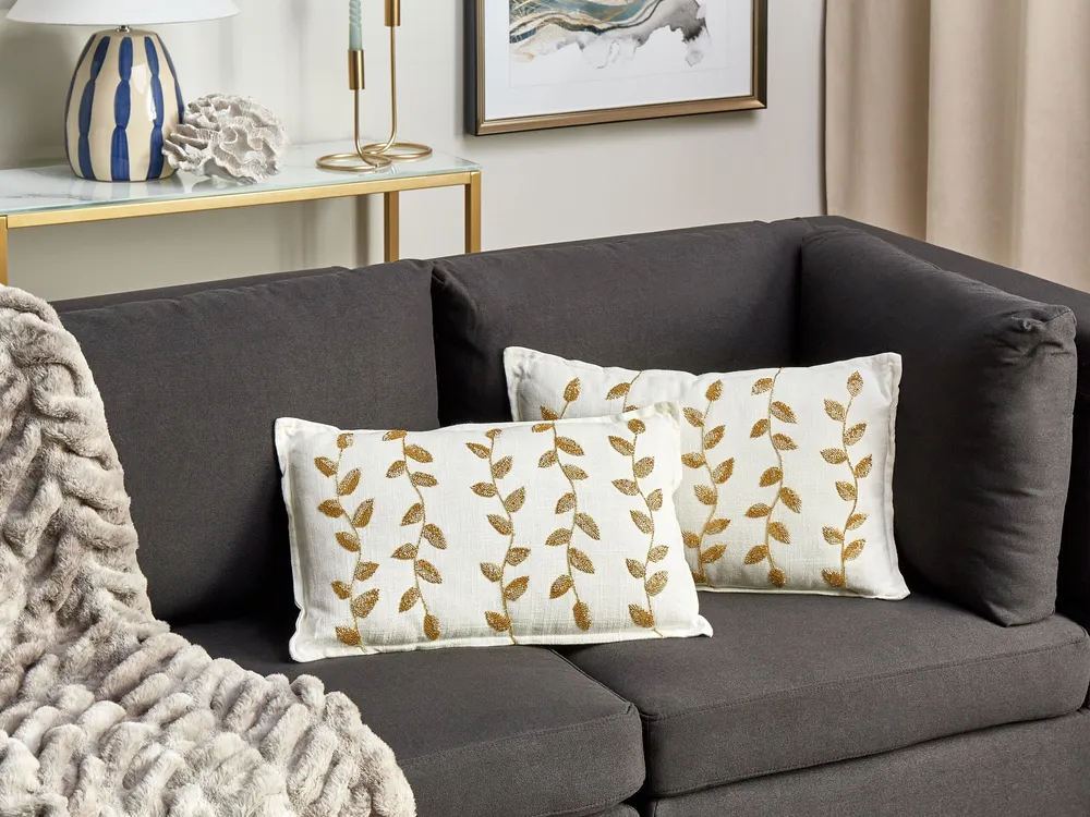 Conjunto de 2 almofadas decorativas com comum de folhas em algodão branco e dourado 30 x 50 cm NERIUM